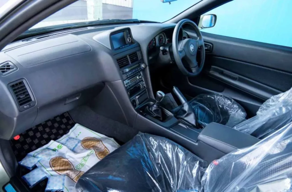 Cuando estrenar un Nissan GT-R R34 se paga a precio de 18 Nissan Qashqai 2 Motor16 2002 Nissan GT-R R34 V Spec II Nür. Imagen interior.